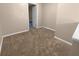 Simple hallway with carpet and access to other rooms at 125 Cainwood W Ct, Atlanta, GA 30349