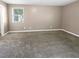 Spacious bedroom with neutral walls and carpet at 125 Cainwood W Ct, Atlanta, GA 30349