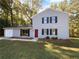 Gray sided two story house with landscaping at 125 Cainwood W Ct, Atlanta, GA 30349