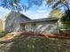Gray sided two story house with landscaping at 125 Cainwood W Ct, Atlanta, GA 30349