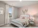 Bedroom with a bed, window, and wall decor at 1261 Arnhem Dr, Hampton, GA 30228