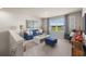 Bright loft area with blue sofa and window seat at 1261 Arnhem Dr, Hampton, GA 30228