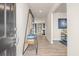 Bright entryway with modern shelving unit and hardwood floors at 1261 Arnhem Dr, Hampton, GA 30228