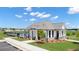 Community pool house with a gray roof and white siding at 1261 Arnhem Dr, Hampton, GA 30228