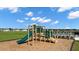 Community playground with slide and climbing structure at 1261 Arnhem Dr, Hampton, GA 30228