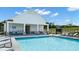 Relaxing community pool with lounge chairs and cabana at 1261 Arnhem Dr, Hampton, GA 30228