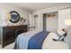 Bedroom featuring dark dresser, closet, and bed at 1261 Arnhem Dr, Hampton, GA 30228