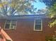 Brick house exterior showing roofline and windows at 718 Springlake Rd, Lawrenceville, GA 30045