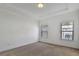 Well-lit bedroom featuring neutral wall-to-wall carpeting at 1813 Hislop Ln, Atlanta, GA 30345