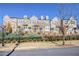 Brick townhouses with a manicured lawn and black fence at 1813 Hislop Ln, Atlanta, GA 30345