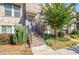 Townhouse entrance with brick steps and landscaping at 1813 Hislop Ln, Atlanta, GA 30345