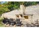 Community outdoor fireplace and seating area at 1813 Hislop Ln, Atlanta, GA 30345