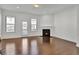 Living area with hardwood floors, fireplace, and access to patio at 1813 Hislop Ln, Atlanta, GA 30345