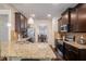 Open kitchen with granite countertops and stainless steel appliances at 6918 Diamond Dr, Rex, GA 30273