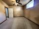 Spacious carpeted bedroom with ceiling fan and window at 1225 Creek Laurel Dr, Lawrenceville, GA 30043