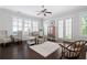 Bright living room with hardwood floors, large windows, and comfortable seating at 244 Rope Mill Rd, Woodstock, GA 30188