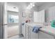 Shared bathroom with double vanity and view of bedroom at 244 Rope Mill Rd, Woodstock, GA 30188