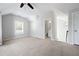 Large bedroom with ensuite bathroom and carpet flooring at 244 Rope Mill Rd, Woodstock, GA 30188