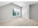 Spacious bedroom with large window and double door closet at 244 Rope Mill Rd, Woodstock, GA 30188