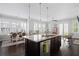 Spacious kitchen with island, stainless steel appliances, and hardwood floors at 244 Rope Mill Rd, Woodstock, GA 30188