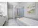 Elegant bathroom with soaking tub, walk-in shower, and double vanity at 244 Rope Mill Rd, Woodstock, GA 30188