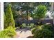 Landscaped backyard with brick patio and seating area at 244 Rope Mill Rd, Woodstock, GA 30188