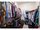 Large walk-in closet with ample hanging space and shelving at 244 Rope Mill Rd, Woodstock, GA 30188