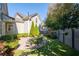 Landscaped backyard with patio, offering a private oasis at 244 Rope Mill Rd, Woodstock, GA 30188