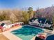 Community pool and clubhouse with covered patio and wooded backdrop at 2582 Fairview Ln, Jonesboro, GA 30236