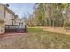 Large backyard with a deck and wooded area at 2582 Fairview Ln, Jonesboro, GA 30236