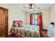 Bedroom with a queen-size bed and floral bedding at 2582 Fairview Ln, Jonesboro, GA 30236