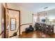 Bedroom with hardwood floors, a workspace, and access to hallway and stairs at 2582 Fairview Ln, Jonesboro, GA 30236