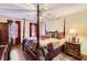 Bright bedroom with a king-size bed, hardwood floors, and ample natural light at 2582 Fairview Ln, Jonesboro, GA 30236