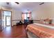 Bedroom with hardwood floors, ceiling fan, and a workspace at 2582 Fairview Ln, Jonesboro, GA 30236