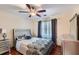Bedroom with a queen-size bed and dark bedding at 2582 Fairview Ln, Jonesboro, GA 30236