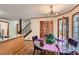 Bright dining area with glass table and purple accents at 2582 Fairview Ln, Jonesboro, GA 30236