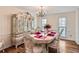 Formal dining room with hardwood floors and chandelier at 2582 Fairview Ln, Jonesboro, GA 30236