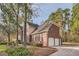 Two-story house with a three-car garage and landscaping at 2582 Fairview Ln, Jonesboro, GA 30236