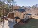 House exterior with two-car garage and deck at 2582 Fairview Ln, Jonesboro, GA 30236
