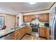 Updated kitchen with stainless steel appliances and granite countertops at 2582 Fairview Ln, Jonesboro, GA 30236