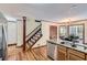 Kitchen features stainless steel appliances, granite counters, and hardwood floors at 2582 Fairview Ln, Jonesboro, GA 30236