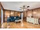 Spacious living room featuring hardwood floors, wood paneling, and a comfortable seating area at 2582 Fairview Ln, Jonesboro, GA 30236