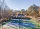 Two tennis courts with surrounding trees at 2582 Fairview Ln, Jonesboro, GA 30236
