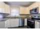 Updated kitchen with white cabinets, granite counters, and stainless steel appliances at 2775 Tilson Rd, Decatur, GA 30032