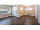 Living room with dark wood floors and access to other rooms at 2775 Tilson Rd, Decatur, GA 30032