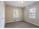 Bright bedroom with carpet flooring and two windows at 2775 Tilson Rd, Decatur, GA 30032