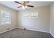 Spacious bedroom with ceiling fan, neutral walls, and carpet flooring at 2775 Tilson Rd, Decatur, GA 30032