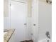 Clean bathroom with white tile and a linen closet at 2775 Tilson Rd, Decatur, GA 30032