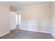 Bedroom with wood accent wall, carpet, and access to hallway at 2775 Tilson Rd, Decatur, GA 30032
