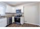 Modern kitchen with white cabinets and stainless steel appliances at 2775 Tilson Rd, Decatur, GA 30032